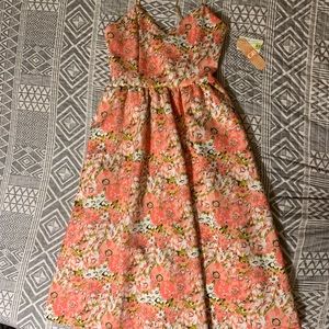 Floral coral mid dress with pockets.